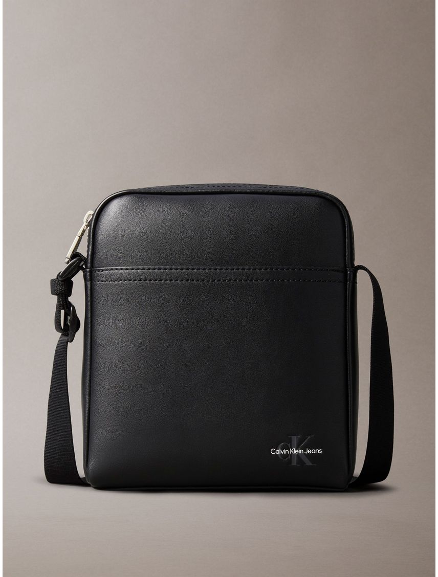 Bolso negro reporter con logotipo