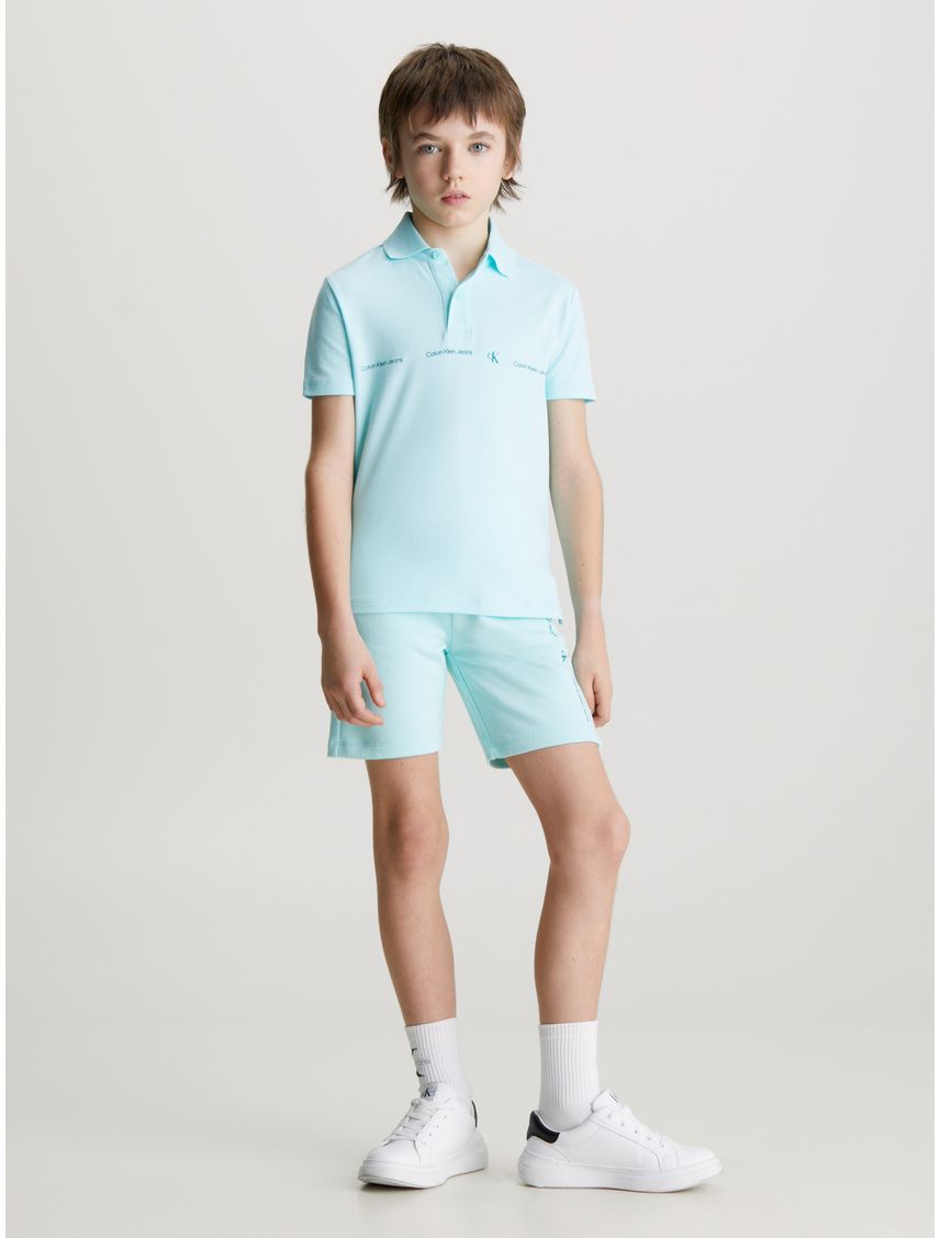 Polo Para Niño Azul Con Logo Repetido