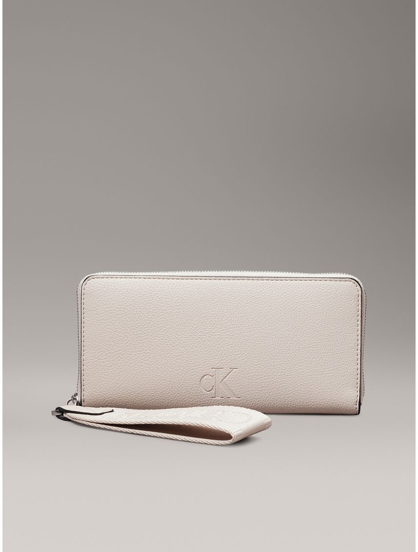 Billetera beige con cremallera en el contorno