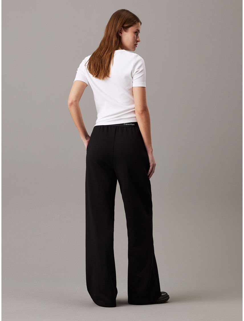 Pantalones negro de pierna ancha con cinta con el logo