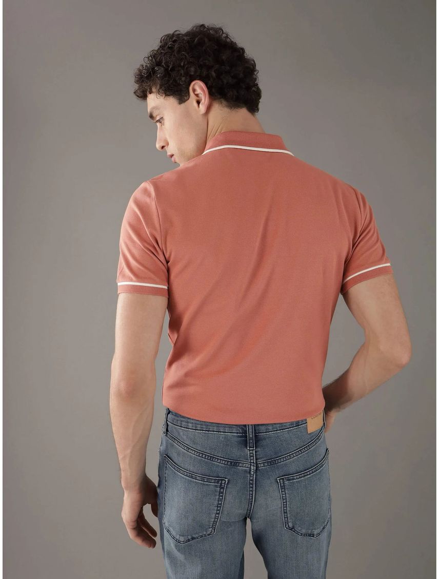 Polo naranja slim con ribete en contraste