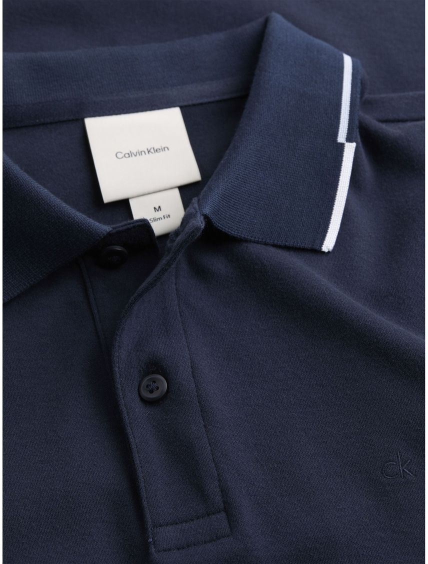 Polo azul slim con etalle en bores