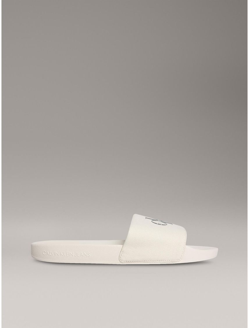 Sandalias beige deslizantes con monograma