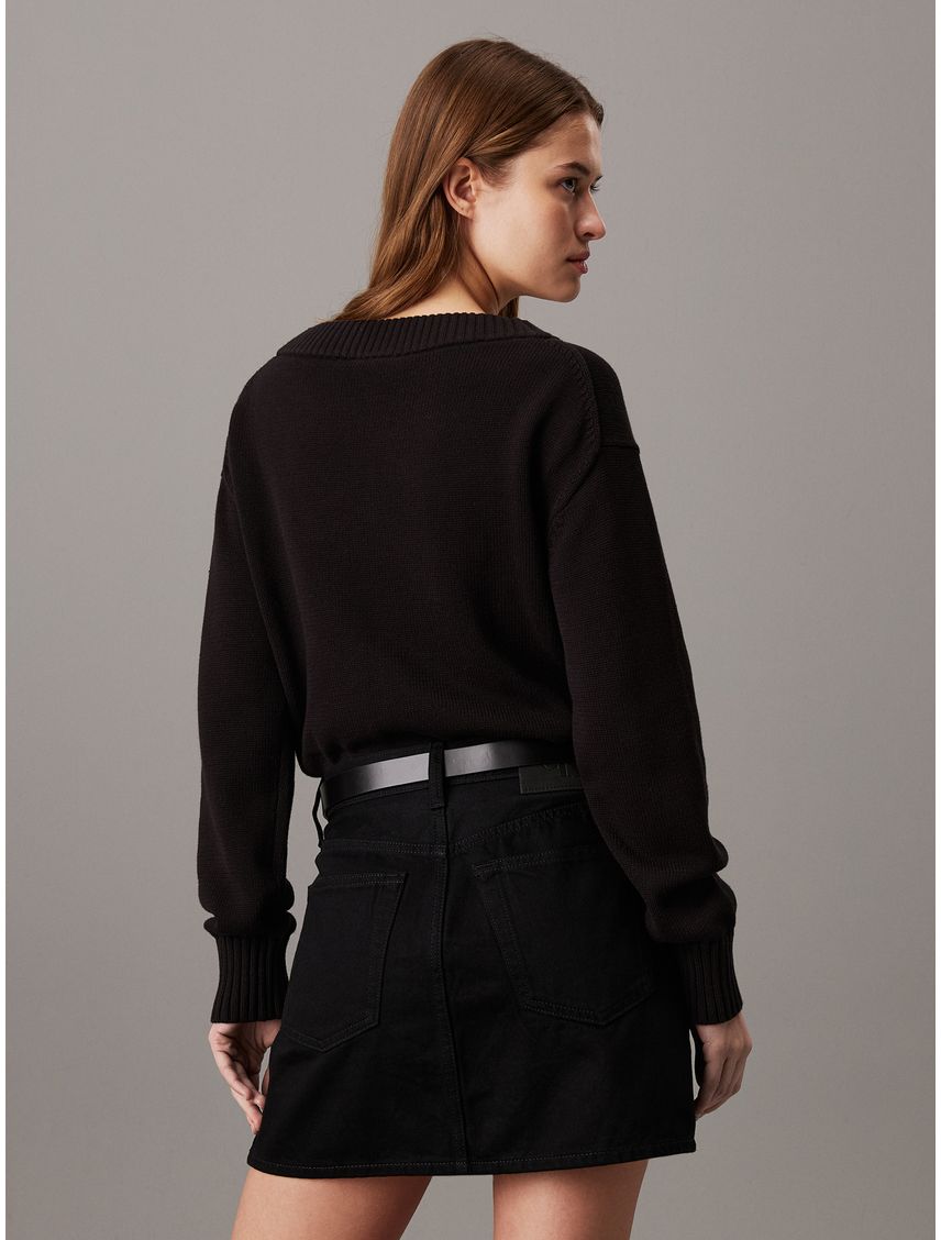 Saco negro tejido de pico con insignia de algodón